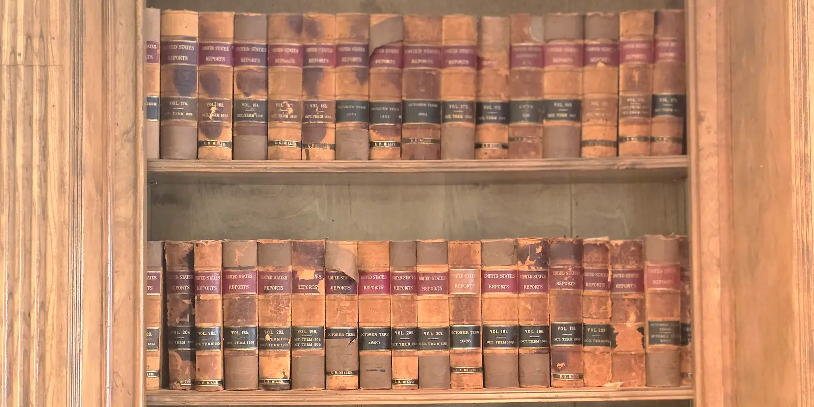 Bound volumes of United States Reports on the bookcase in the Barnett Law Firm conference room.